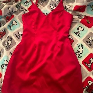 Red silky dress, has side pockets. Its perfect to size. Not stretchy.